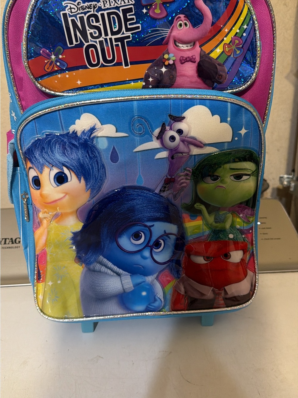 Inside Out Kids Character Rolling Backpack in Blue and Pink